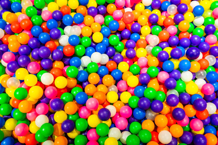 A dazzling mix of vibrant balls in a cheerful playground setting.の写真素材