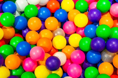 A vibrant display of multicolored balls in a playful dry pool.の写真素材