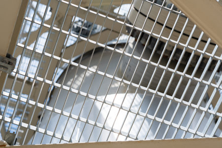 Close-up view of an industrial metal grid and engineering structure showcasing functional designの写真素材