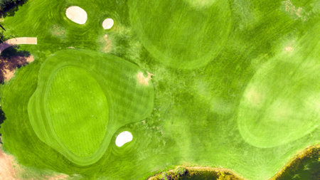 Aerial view of a golf course putting green with sand bunkers and hole locationsの写真素材
