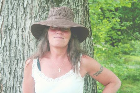 Pretty woman wearing brown hatの写真素材