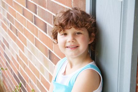 Cute little girl outside smilingの写真素材