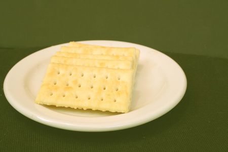 Pile of white crackers on plateの写真素材