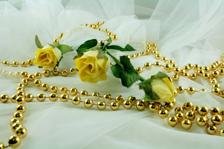 Yellow roses and beads for wedding decorationの写真素材