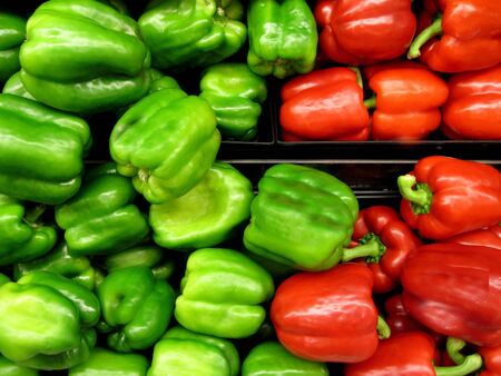 Box of red and green peppers fresh from gardenの写真素材