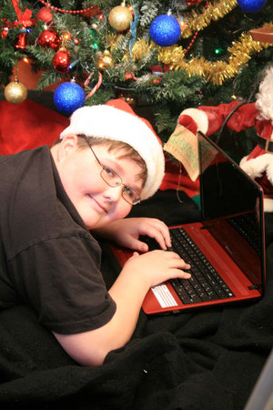 Boy with new laptop at Christmas