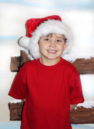 Little boy at Christmas in snowの写真素材