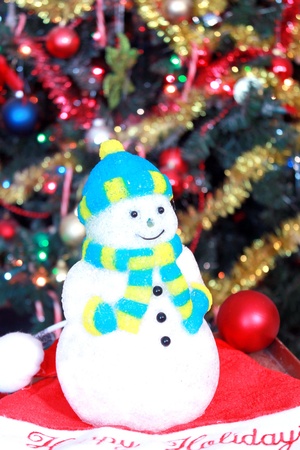Snowman decoration under Christmas treeの写真素材