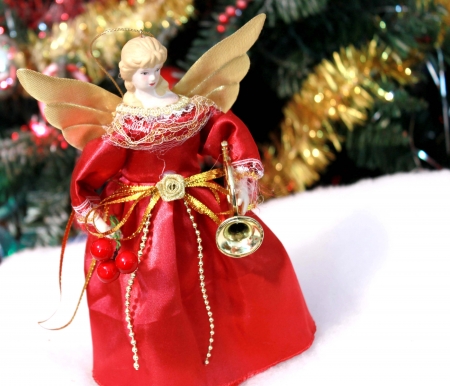 Christmas angel decoration under treeの写真素材