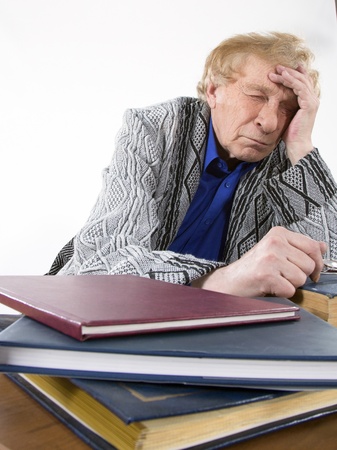 Face portrait of a smiling senior man sitting in an armchair の写真素材