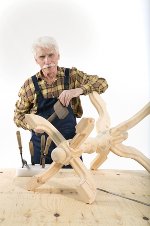 Old woodcarver work in the workshopの写真素材