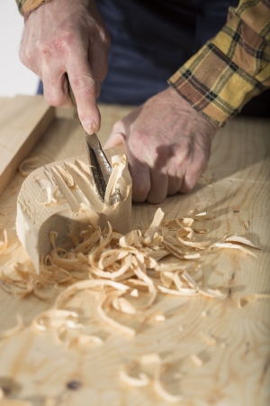 Old woodcarver work in the workshopの写真素材