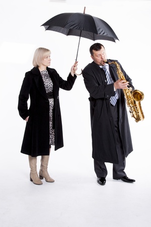 
lone musician and hand girl with an umbrella               
の写真素材