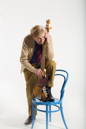 old rocker with guitar reflects on the past, plays musicの写真素材