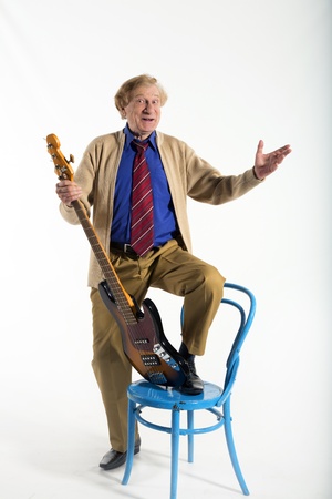 old rocker with guitar reflects on the past, plays musicの写真素材