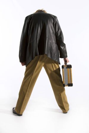 Mafia gangster with a suitcase of money  Isolated on white resting, running, backの写真素材