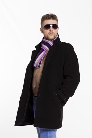 Portrait of handsome stylish blond man in sunglasses and a coatの写真素材