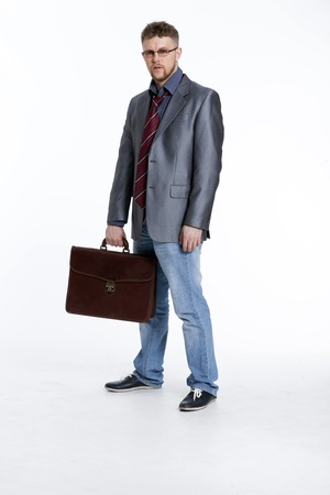 Young business man on his way to work, rest, talking, sitting, reflectsの写真素材