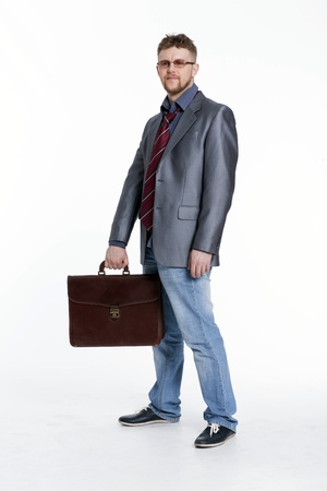Young business man on his way to work, rest, talking, sitting, reflectsの写真素材