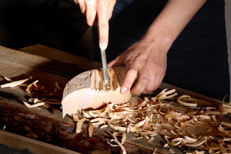 Old woodcarver work in the workshop