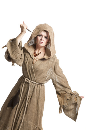 female in costume of savage woman with knifeの写真素材