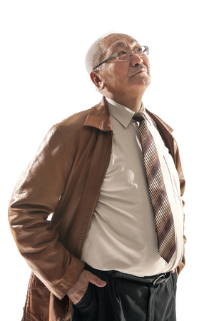 isolated portrait of mature man looking upの写真素材