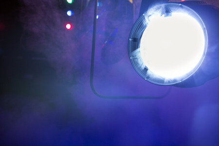 stage colored lights on a console, smokeの写真素材