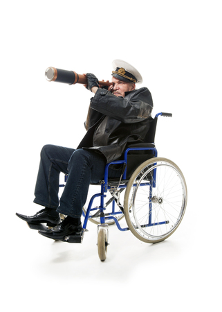 old sailor man sitting on wheelchairの写真素材
