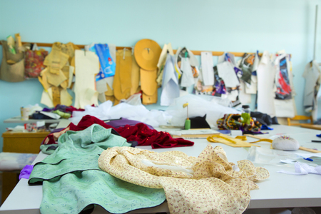 fashion designer studio with professional equipment, sketches, mannequins, clothの写真素材
