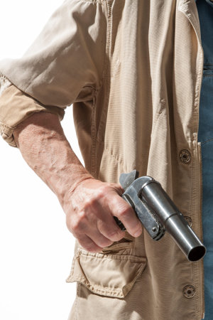 Man with a gun in his hand isolated on white background