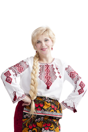 Beautiful woman wearing national ukrainian clothes posing to the cameraの写真素材
