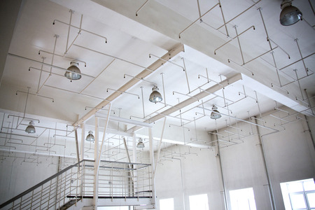Fire alarm system, old sprinkler system in the ceiling of the production room.の写真素材