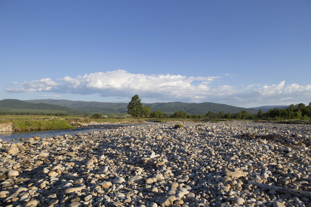Siberian river in clear weather in the highlandsの写真素材