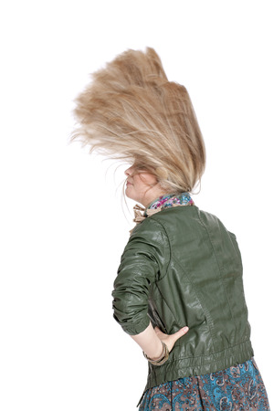 Beautiful blonde girl posing in a photo studio carved on white backgroundの写真素材