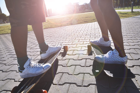 Longboarding, skateboarding, fun sport in a city park