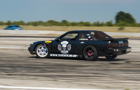 Vinnytsia,Ukraine-July 24, 2015: Rider  Nikolay Volkov  on the car brand Nissan overcomes the track in the  Drift championship of Ukraine  on July 24,2015 in Vinnytsia, Ukraine.のeditorial素材