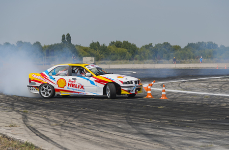 Vinnytsia,Ukraine-July 24, 2015: Rider V. Borovitsky  on the car brand BMW   makes a mistake on the track in the  Drift championship of Ukraine  on July 24,2015 in Vinnytsia, Ukraine.のeditorial素材