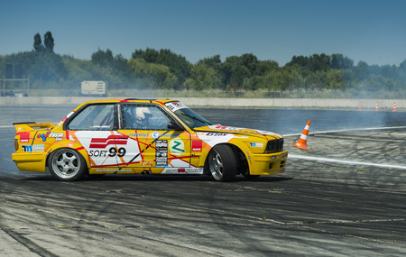 Vinnytsia,Ukraine-July 24, 2015: Rider Vladimir Palariev  on the car brand BMW   makes a mistake on the track in the  Drift championship of Ukraine  on July 24,2015 in Vinnytsia, Ukraine.のeditorial素材