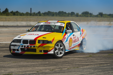 Vinnytsia,Ukraine-July 24, 2015: Rider V. Borovitsky  on the car brand BMW overcomes the track in the  Drift championship of Ukraine  on July 24,2015 in Vinnytsia, Ukraine.のeditorial素材
