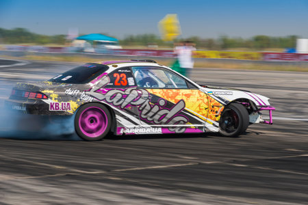 Vinnytsia,Ukraine-July 25, 2015: Unknown rider  on the car brand Honda overcomes the track in the ...