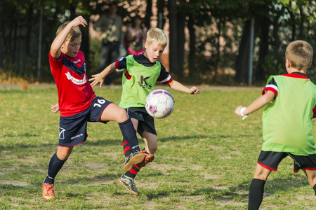 Lviv, Ukraine - 30 Septemberl 2016: Boys playing football on the playground near the school Lviv.のeditorial素材