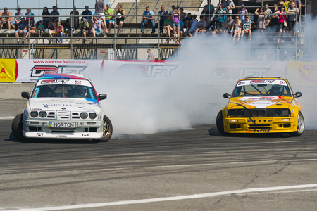 Lviv, Ukraine - Juny 7, 2015:  Rider Ruslan Yezerov and Volodymyr Palariev  on the car brand BMW overcomes the track in the championship of Ukraine drifting in Lviv.のeditorial素材