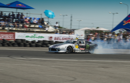 Lviv, Ukraine - June 7, 2015:  Rider Dmytro ILLYUK near his  car brand Nissan before  the championship of Ukraine drifting in Lviv, Ukraineのeditorial素材