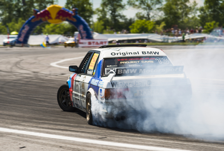 Lviv, Ukraine - Juny 6, 2015:  Rider Ruslan Yezerov  on the car  brand BMW overcomes the track in the championship of Ukraine drifting in Lviv.のeditorial素材