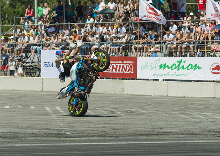 lLviv, Ukraine - June 7, 2015: Unknown stunt bikers  entertain the audience before the start of the championship of drifting near Arena - Lviv stadium in Lviv, Ukraine.のeditorial素材