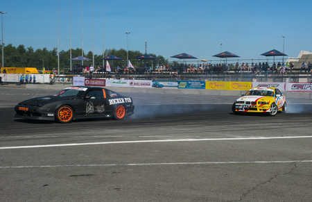 Lviv, Ukraine - Juny 7, 2015: Unknown riders on the car brand Nissan and BMW overcomes the track in the championship of Ukraine drifting in Lviv.のeditorial素材