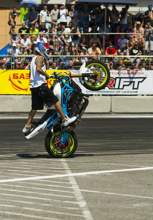 Lviv, Ukraine - June 6, 2015: Unknown stunt biker entertain the audience before the start of the championship of Ukraine drifting in Lviv.のeditorial素材