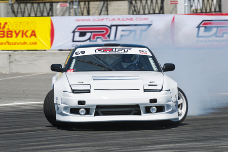 Lviv, Ukraine - Juny 6, 2015: Unknown rider on the car brand Nissan overcomes the track in the championship of Ukraine drifting in Lviv.のeditorial素材