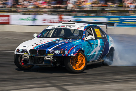 Lviv, Ukraine - Juny 6, 2015:  Rider Igor Zapisniy on the car brand BMW overcomes the track in the championship of Ukraine drifting in Lviv.のeditorial素材
