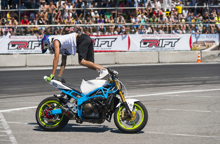 Lviv, Ukraine - June 6, 2015: Unknown stunt biker entertain the audience before the start of the championship of Ukraine drifting in Lviv.のeditorial素材